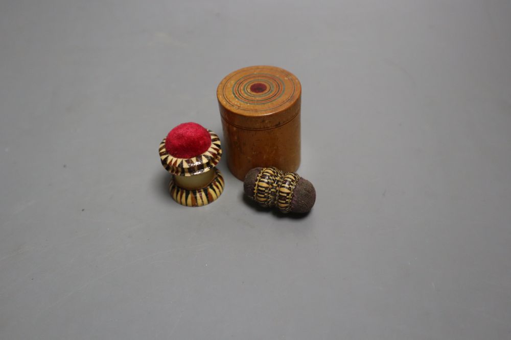 Four Tunbridgeware needlework accessories, a Tunbridgeware clothes brush, a miniature measure, a table clamp and a thread storage box,